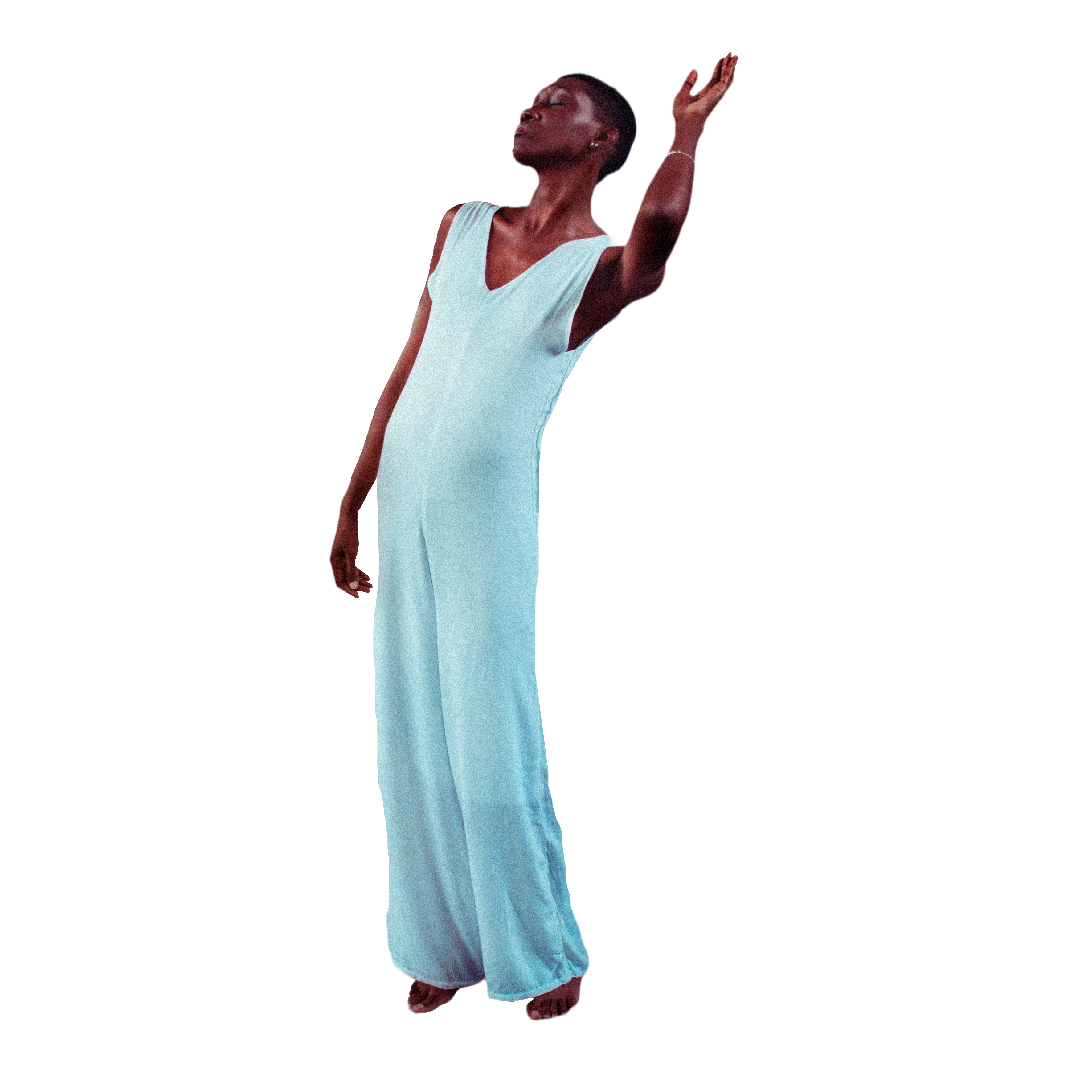 Woman in flowing pale blue reaching toward the light — energy healing in Detroit